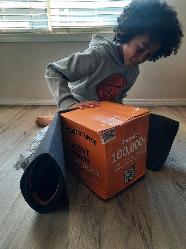 Young player opening the QBounce box