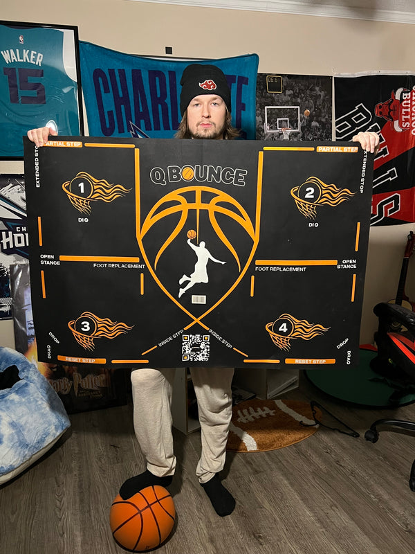 Customer holding up the QBounce training mat